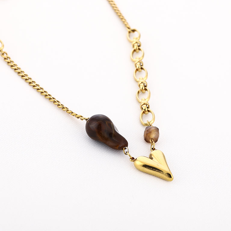 Asymmetrische ketting met hartje – goudkleurig